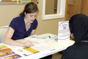 Erin Milliren of the United Way of King County's Bridge to Basics Program connects an interested client to community resources and assistance.