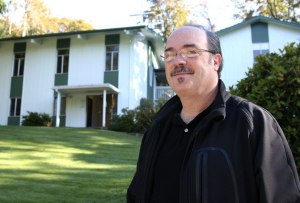 Pastor Don Burnett at Evergreen Community Church stands outside the church's building after its seventh break-in. The most recent break-in occurred Oct. 15
