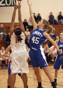 Liberty’s Danni Sjolander goes up for a rebound against Newport Dec. 1.
