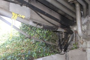 A fire set under the Williams Avenue bridge this past weekend caused an estimated $5