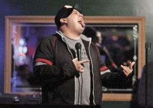 Rodger Lizaola demonstrates the differences between hitting on women sober and drunk on is way to a win in a comedy contest featuring six comedians recently at DC's Bar and Grill in Renton.