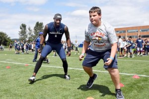 Seahawks wide receiver Ricardo Lockette put a participant through the paces at the NFL Play 60 event last week at the VMAC in Renton.