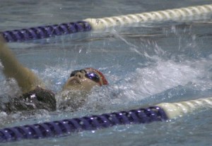 Renton's Tonie Canlas swims the first leg of the Indians' 200-yard medley relay Friday evening. Renton finished fourth in the event.