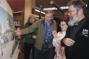 Renton residents get their first look at exterior drawings of the proposed new downtown library during an Open House March 26.