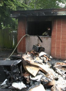 Lieutenant firefighter Kevin Correa works on cleaning up an Skyway apartment after it caught fire Tuesday morning.