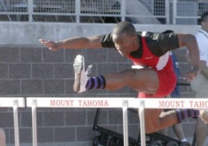 Renton's Tevin Ponders clears a hurdle in the 110-meter race. Ponders finished fourth in the state.
