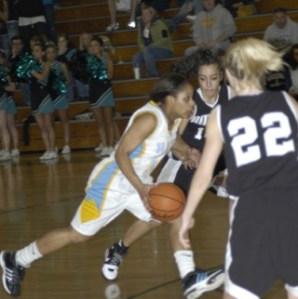 Hazen's Airashay Rogers drives to the basket against Bonney Lake March 6.