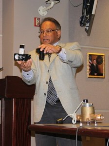 Renton Water Engineer Supervisor Abdoul Gafour shows the council the city's radio-read water meter system March 25.