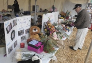 A memorial has grown for the two boys who drowned in the Green River when the car in which they were passengers drove into the river.