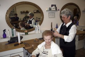 Betty Richards gets a cut from her daughter Judy Ford during one of her Friday morning visits to Center Coiffures