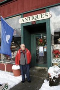 Rod Stewart stands outside his antique shop on South Third Street Monday morning