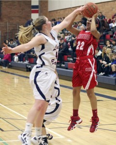 Lindbergh’s Emily Graver tries to block the shot of Renton’s Jordan Armstrong.