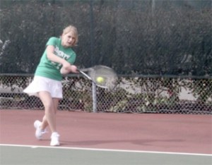 Liberty sophomore Amber Eastham returns a ball during practice at Liberty.