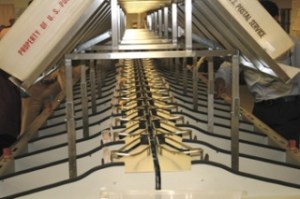 Ballots are sorted by legislative district Tuesday as one step in their tabulation at the King County Elections Office in Renton.