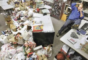 McKnight Middle School seventh-grade teacher Dave Black takes calls Wednesday at his desk