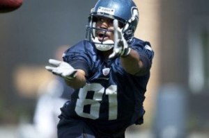 Wide receiver Nate Burleson reaches for a pass at practice.