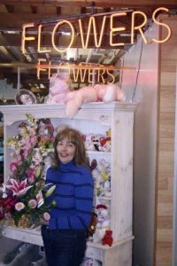 Shannon Carpenter holds a spring bouquet in Malesis Flowers & Gifts