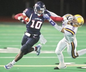 Matt Brashears/Renton Reporter Lindbergh's Willie Creear stiff arms a Columbia River defender as he rushes for a gain Friday at Renton Memorial Stadium.
