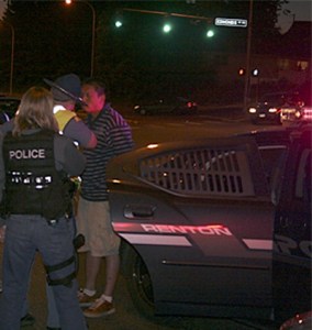 Police took into custody a suspect they believe hit a Renton Police officer who was directing traffic at Edmonds Avenue and Sunset Boulevard away from the Harrington Square apartments on Harrington Avenue Tuesday night.