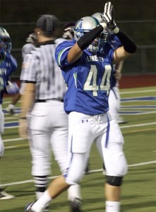 Liberty's Cameron Talley celebrates after a safety against Mercer Island.