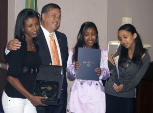 Mayor Denis Law poses with the EriAm sisters