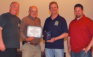 Skyway resident Jim Hutchins (second from left) receives the 2014 Bill Johnson True Trade Unionist Award from Machinists Union District Lodge 751. Also pictured are (left to right) Robley Evans