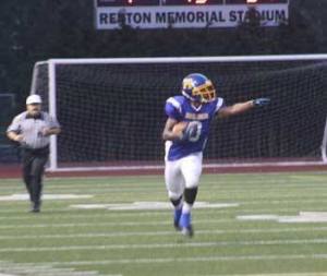 Hazen's Marquise Lee directs traffic during a fake punt in the first quarter of Friday's game against Liberty. Lee made it to the end zone