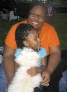 Cynthia and her daughter Divinity Wilkins watch the “Moonlight Movie” with Suzy Q.