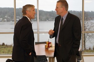 Seahawks coach Pete Carroll (left) talks with Todd Leiweke