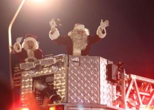Santa and Mrs. Claus arrive at the Piazza during last year's tree lighting event. This year's event is set for Saturday.
