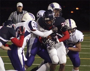Lindbergh's Bakari Davis drags a pack of Anacortes defenders Friday night.