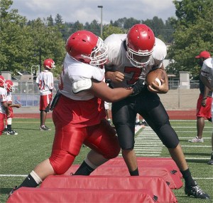 Renton senior P.J. Mattingly (right) leads a group of experienced linebackers that will be key for the Indians’ defense.