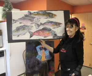 Sherry Lee practiced the Japanese art form of gyotaku or fish rubbing for residents of Spencer Court on Monday.