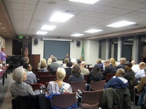A packed house listens and engages the panelists at a Neighborhood Program meeting on embracing the city's diverse populations.