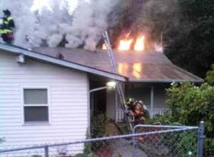 Firefighters battle a blaze in Skyway July 3.