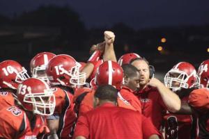 The Renton Indians huddle up during a timeout during Friday's 26-20 win over Olympic.