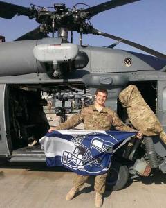 Hazen grad Jordan Hjelmaa of Renton proudly displays his Seahawks flag while deployed with the U.S. Air Force in Afghanistan.