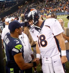 Seattle quarterback Russell Wilson and Denver quarterback Peyton Manning shake hands after an August pre-season game