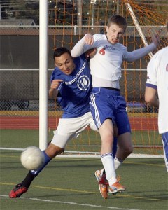 Hazen’s Jordan Lewison battles with an Auburn Mountainview player May 10 in the sub-district playoffs.