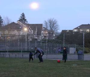 With a full moon hanging in the sky behind them