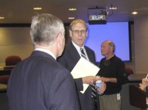 King County Library System Director Bill Ptacek confers with City of Renton representatives after giving an update on library construction plans in the city.
