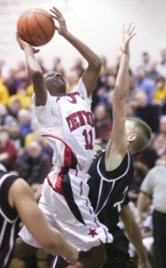 Renton's Achokie Moikobu tries to get past an Enumclaw defender on Feb. 20.