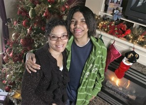 Janis Jones-Thomas and Jovoni Jones pose next to the Christmas tree Dec. 17. Jovoni had a liver transplant a few years ago on Christmas when he was 16