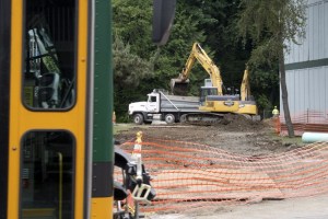 A Metro bus wends it way through the Royal Hills Apartment complex Thursday as a contractor replaces a failed pipeline that runs through the complex in an easement. Royal Hills Drive was to reopen today (Friday) after it was repaved.