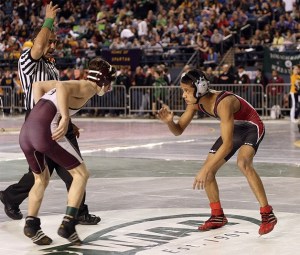 Renton's Saugat Chhetri takes on White River's Richard Geddes in the first round of the 2A state wrestling tournament Feb. 18.