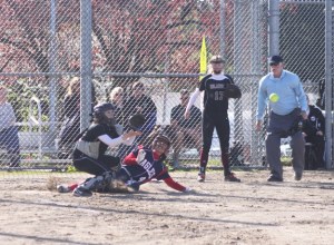 Paula Farrell of Lindbergh slides into home ahead of the throw during Monday's 8-7 win against Mercer Island.