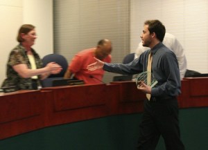 Nathan Maddox accepts the Outstanding Secondary Teacher of the Year Award from the Renton School District Board of Directors April 14. He was one of five to win employee awards from the board this year.