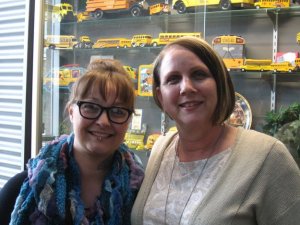 Bus driver Laurie Henrickson poses with Helen Shindell-Butler