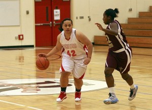 Renton's P.J. Tuiasosopo dribbles around a Tyee defender Dec. 15.