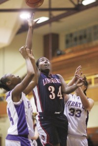 Lindbergh's Marcissa McMillan grabs a rebound over Highline defenders.